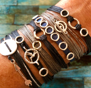 Sterling silver featured in black; paired with Velos (left), Pouli (second to left), Agapi (3rd to left), Ilio (fourth to left), Agapi (polli-monocord), and Mati