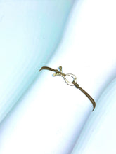 Load image into Gallery viewer, Sterling silver fish featured in taupe