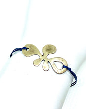 Load image into Gallery viewer, Zamak flower featured in navy