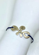 Load image into Gallery viewer, Zamak flower featured in navy