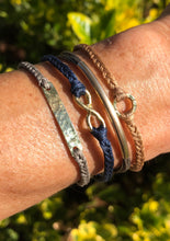 Load image into Gallery viewer, Yellow gold vermeil featured in taupe; paired here with Kinisi, Thormo and Epizo