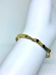 14k yellow gold clasp with cuff featured in taupe