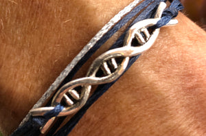 Sterling silver featured in navy with a sparkly silver cord