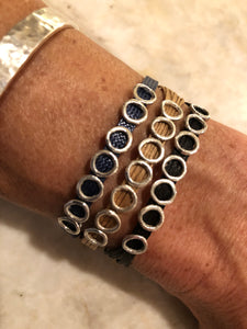 Sterling silver featured in monocord navy, single wrap (left); Sterling silver featured in champagne, single wrap (middle); Sterling silver featured in black, single wrap (right)