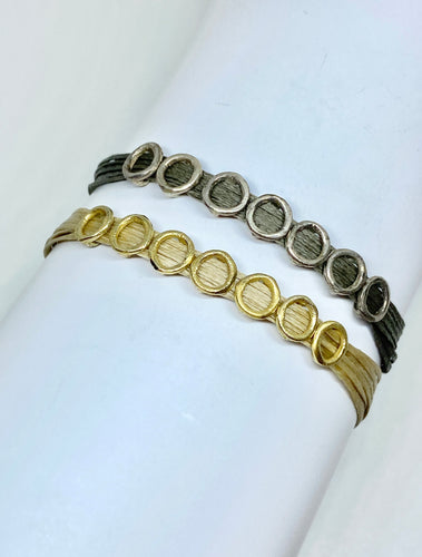 Yellow gold vermeil featured in sand, single wrap (bottom): Sterling silver featured in taupe, single wrap (top)