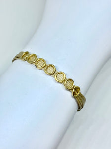 14k gold featured in sand