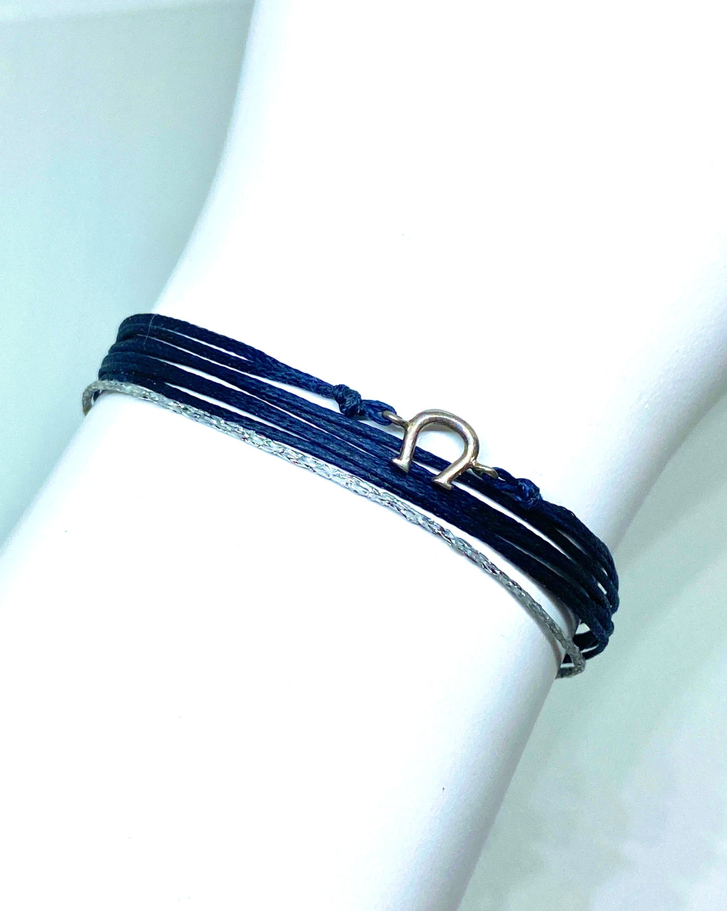 Sterling silver horseshoe featured in navy (original with sparkly cord)