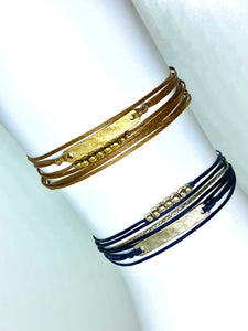 Sterling silver featured in navy (bottom) and yellow gold vermeil featured in champagne (top)