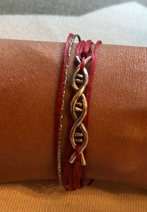 Sterling silver featured in red with a sparkly brown-silver cord