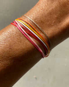 One bracelet with multiple color cords