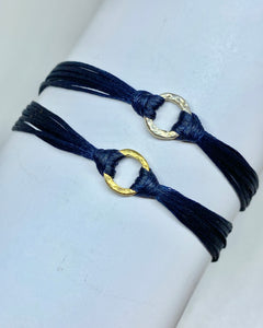Yellow gold vermeil in navy (bottom); Sterling silver in navy (top)
