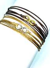 Load image into Gallery viewer, Yellow gold vermeil featured in chocolate (original) (top) and sterling silver featured in champagne (original with sparkly cord) (bottom)