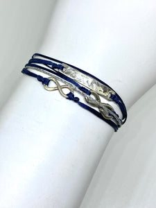 Sterling silver featured in navy with sparkly cord