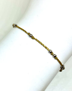 Sparkly gold cord with sterling silver beads