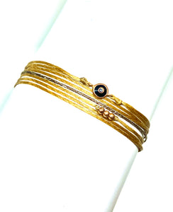 Rose gold vermeil with black enamel featured in champagne (original with sparkly cord)