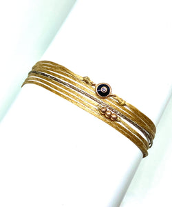 Rose gold vermeil with black enamel featured in champagne (original with sparkly cord)