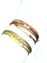 Load image into Gallery viewer, Sterling silver featured in rust (original with sparkly cord( (top) and yellow gold vermeil featured in khaki (original with sparkly cord) (bottom)