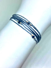 Load image into Gallery viewer, Sterling silver (trea) featured in gray with sparkly cord
